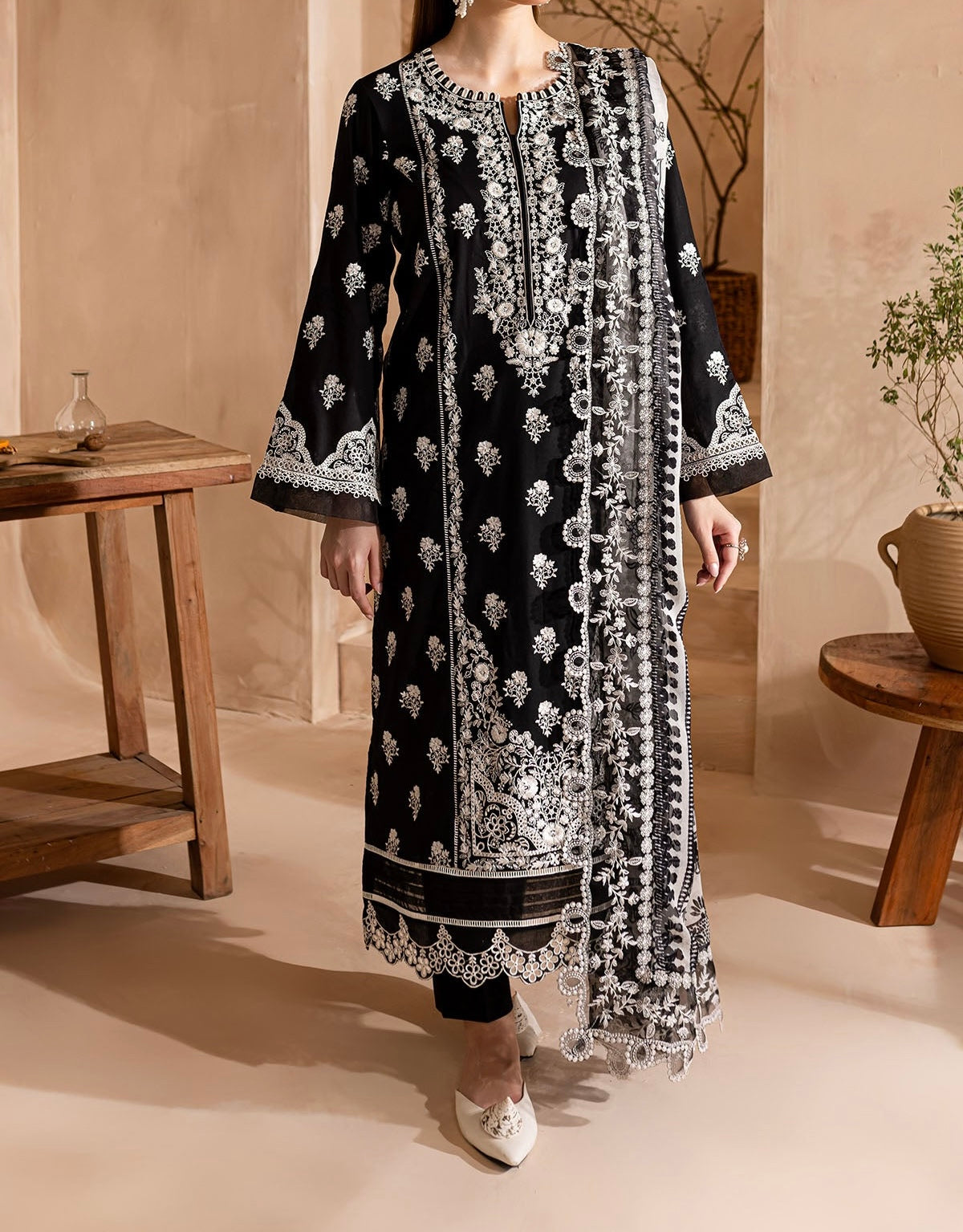 Black Nureh stitched suit with delicate white thread embroidery