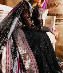 Chiffon dupatta with silver and pink zari borders over black organza suit by Nureh Jhumroo Bano