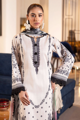 Model wearing Nureh Signature Lawn 3-Piece Stitched Suit in ivory and black embroidery with colorful abstract chiffon dupatta β Marina Mystique summer collection.