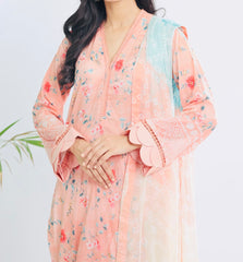 close up of embroidered Nureh SP-114 Signature Lawn suit showing intricate floral detailing on peach lawn fabric β breathable and elegant summer outfit.
