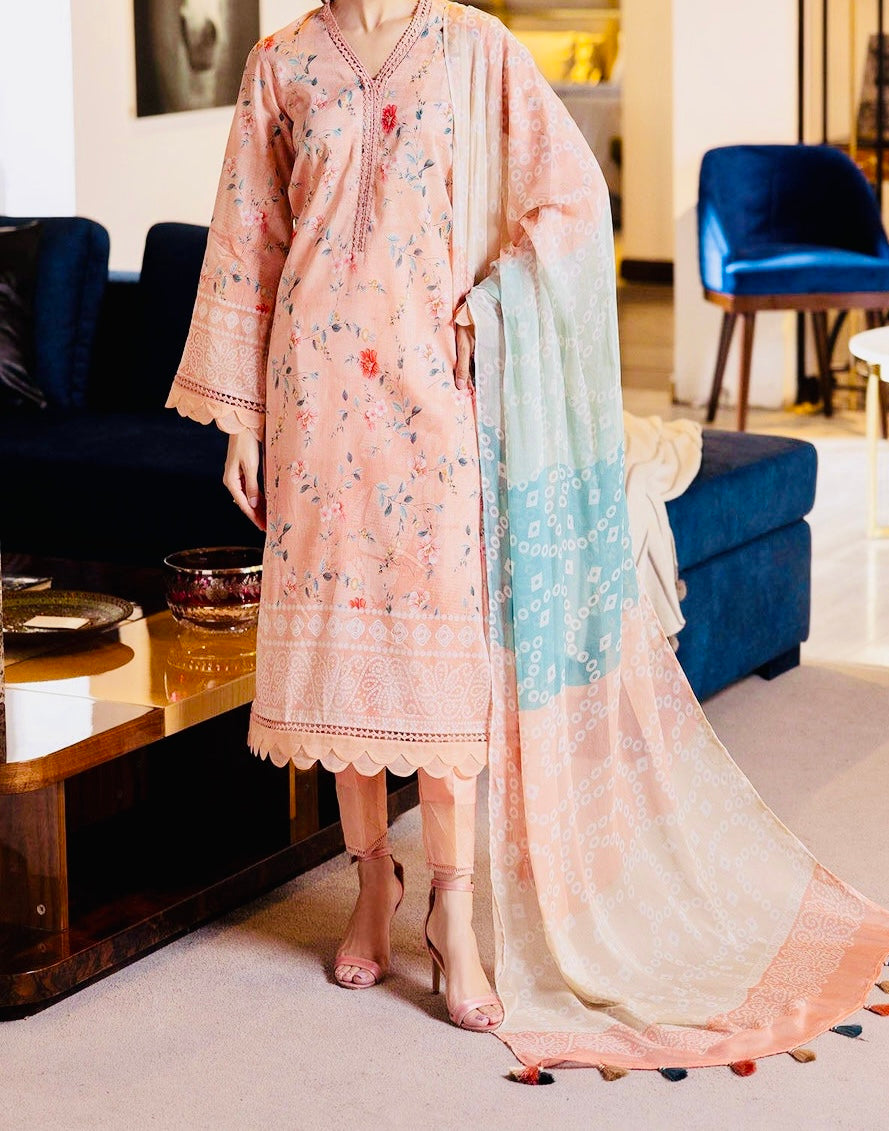 Model wearing Nureh SP-114 Signature Lawn 3-Piece Stitched Suit in soft peach with delicate printed embroidery and chiffon dupatta β Marina Mystique summer collection.