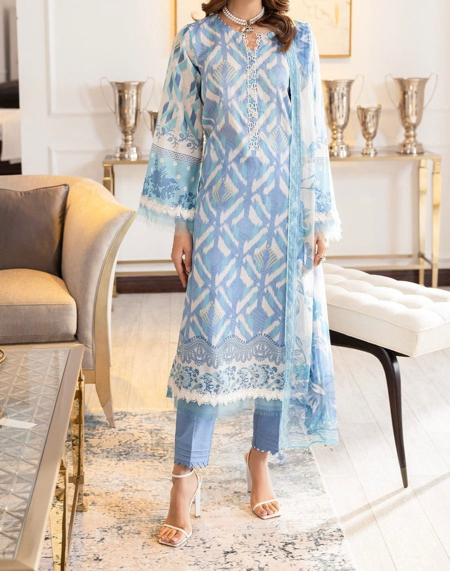 Model wearing Nureh SP-121 Signature Lawn 3-Piece Stitched Suit in sky blue with ivory botanical print and chiffon dupatta β Marina Mystique summer collection.