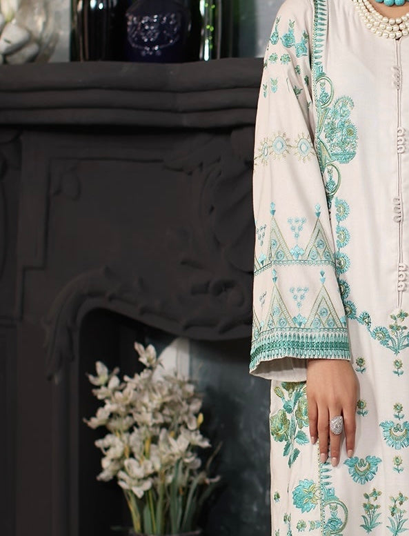 Charizma Side angle showing flowing printed wool shawl and embroidered sleeves – elegant Marina Mystique winter collection design.