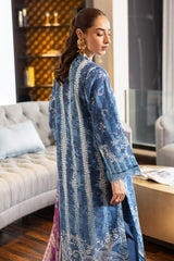 
“Model wearing blue Nureh Signature Lawn stitched suit with full sleeves and knee-length shirt”