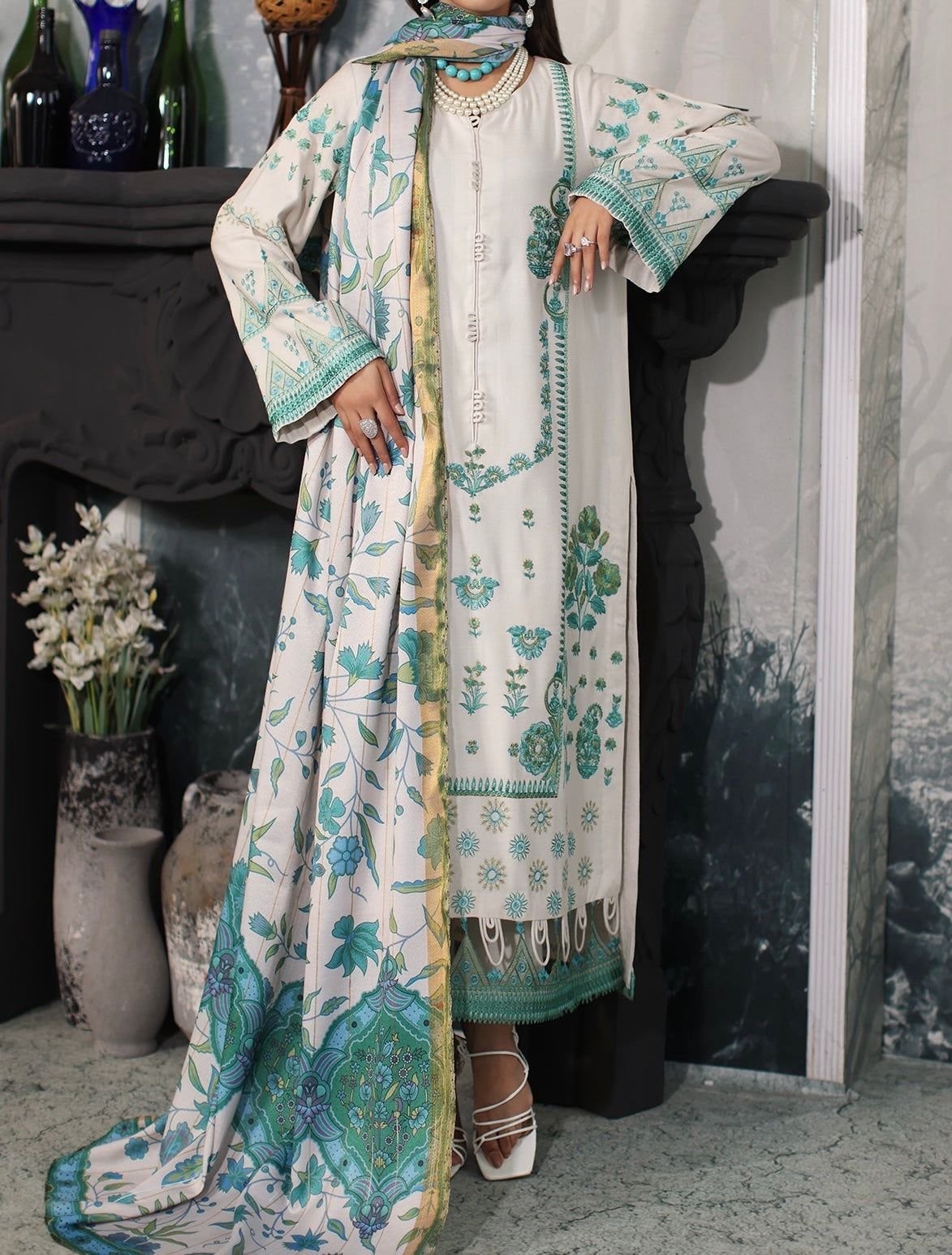 Charizma-Poshima Front view of embroidered Dhank front leather suit with printed teal shawl by Marina Mystique