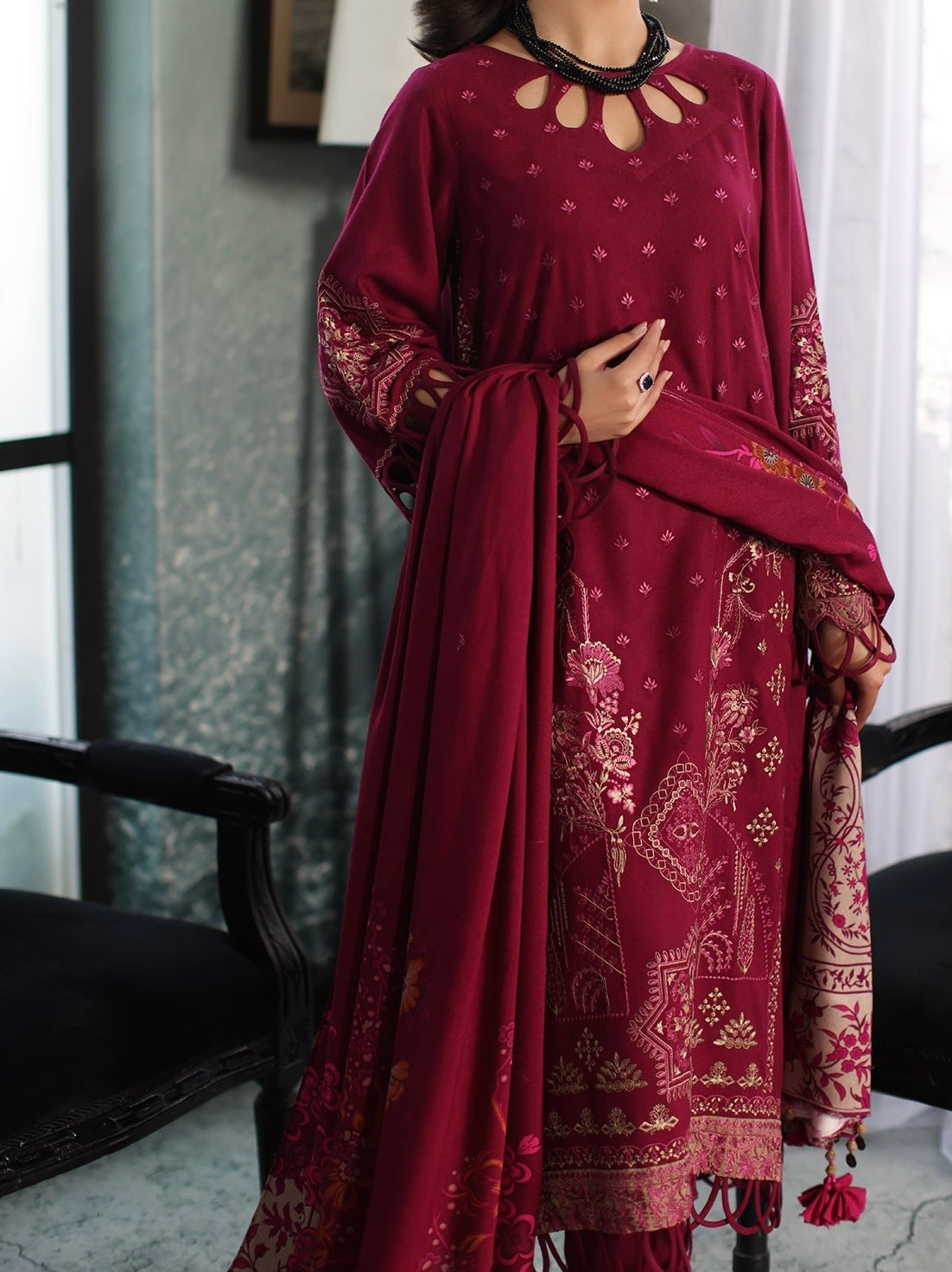 Complete look of maroon embroidered leather outfit styled with printed wool shawl