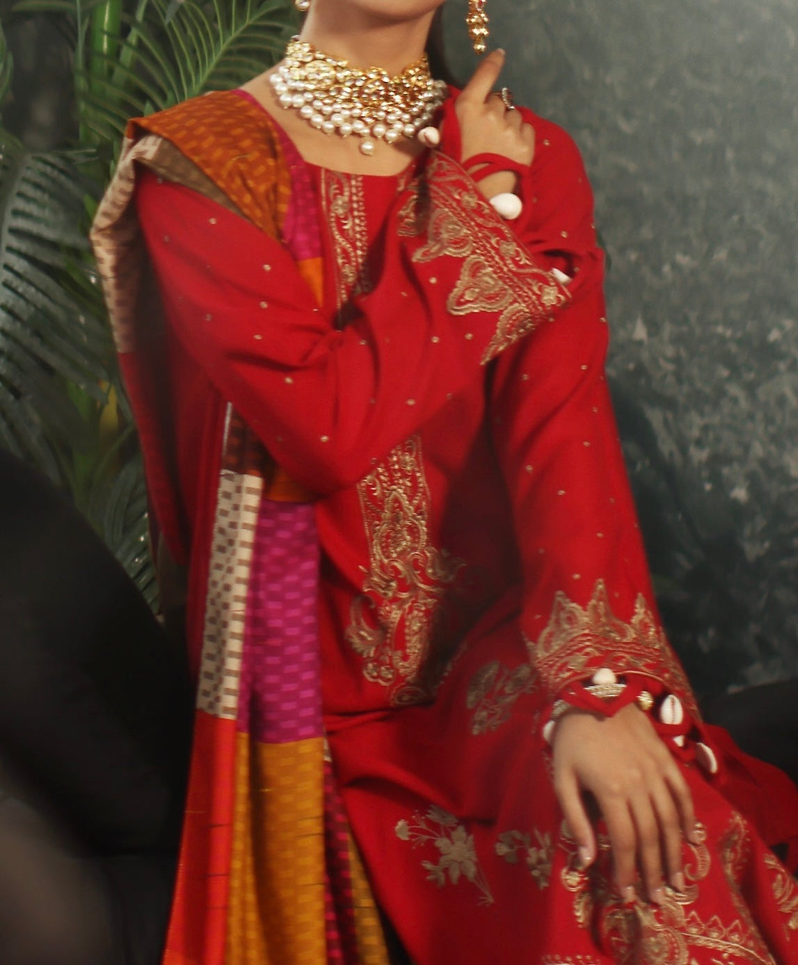 pose showing red leather shirt embroidery and full sleeves – Winter Collection by Marina Mystique
