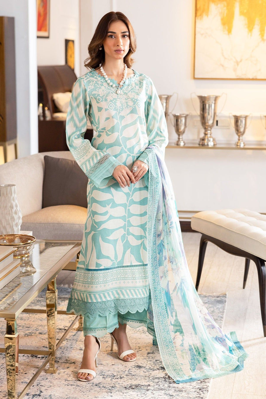 Model wearing Nureh SP-115 Signature Printed Lawn 3-Piece Stitched Suit in pastel sea-green with signature Nureh prints – Marina Mystique summer collection.