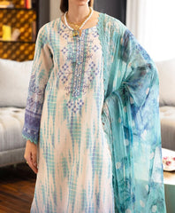 Model wearing Nureh SP-117 Signature Lawn 3-Piece Stitched Suit in pastel turquoise and lavender embroidery – summer collection by Marina Mystique.