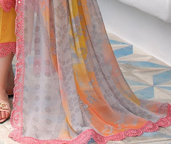 Close-up of the embroidered chiffon dupatta in orange pink ombre tones.