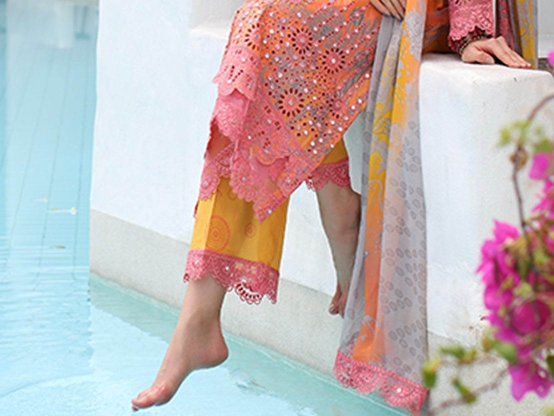 Detailed embroidery close-up on the orange pink lawn shir