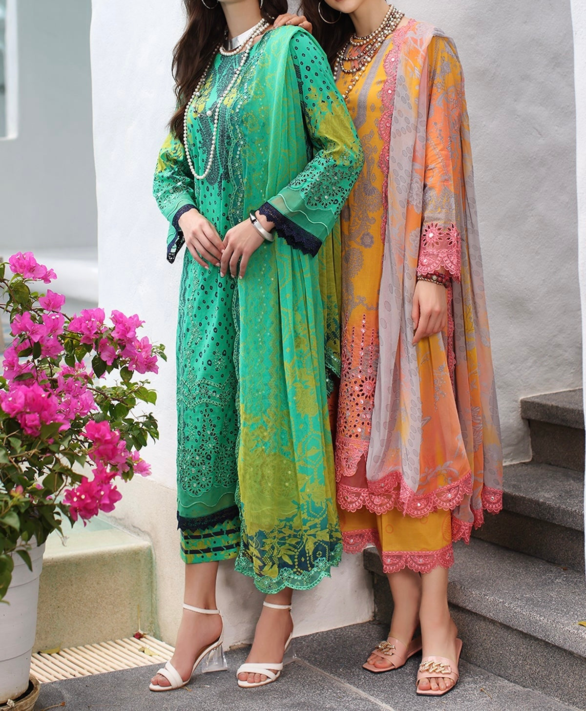 Front full-length view of the light orange pink embroidered lawn suit with flowing dupatta.